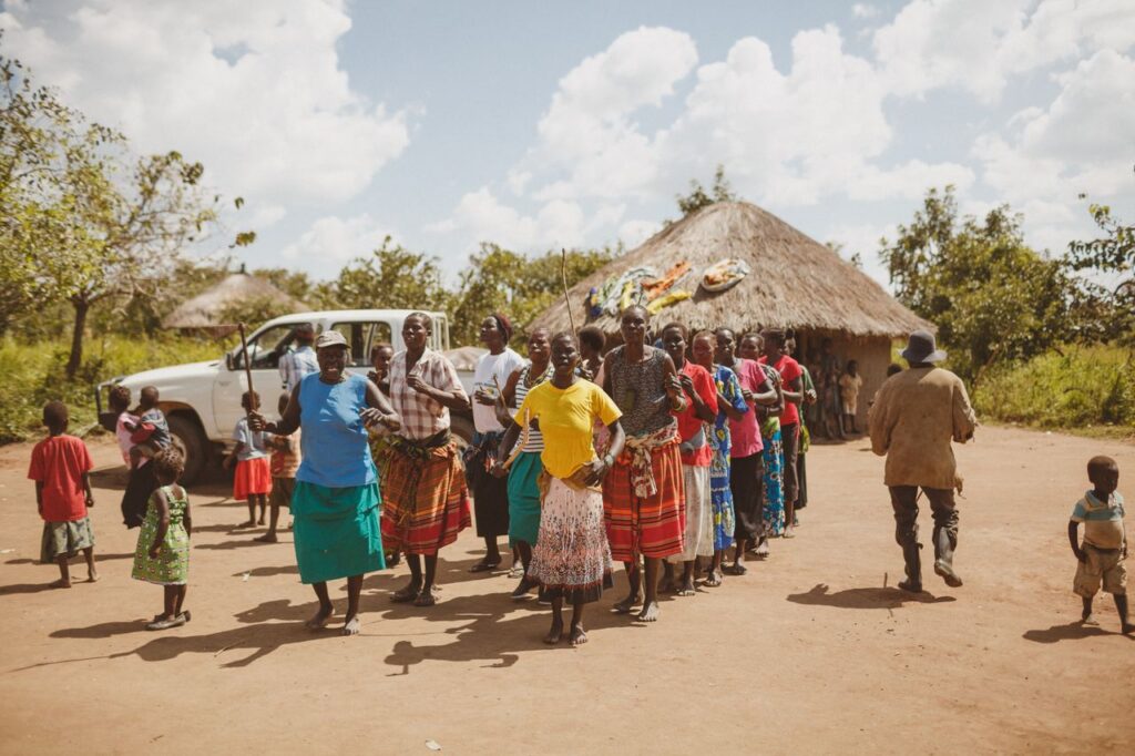 about-01 A vibrant group dance celebration in Kitgum, Uganda, showcasing cultural unity.