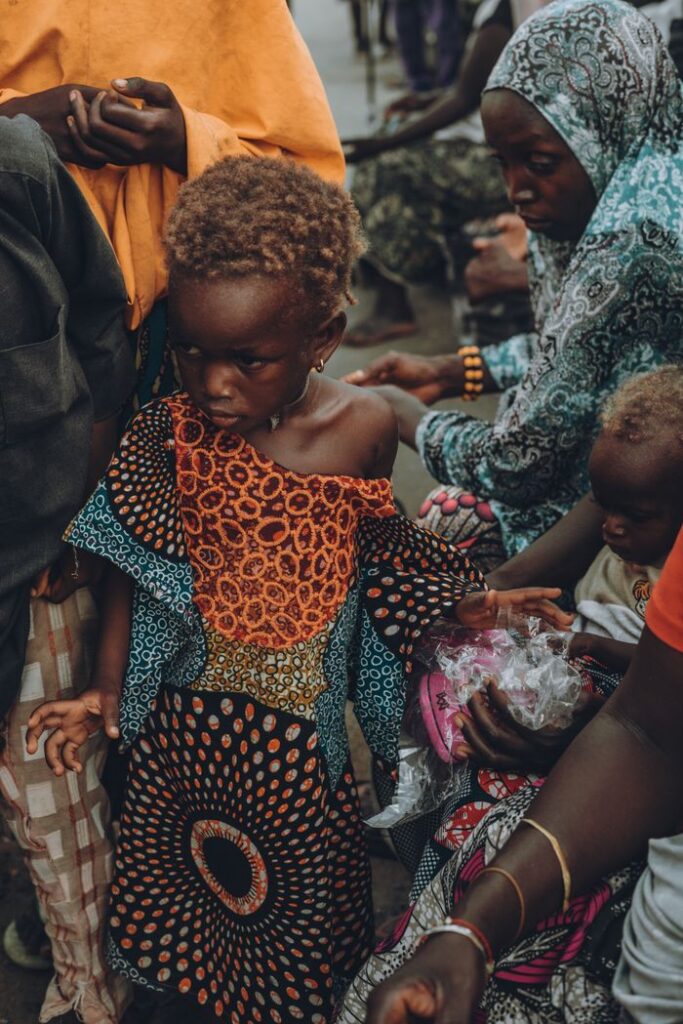 services-01 Vibrant African market scene with people and traditional attire capturing community essence.